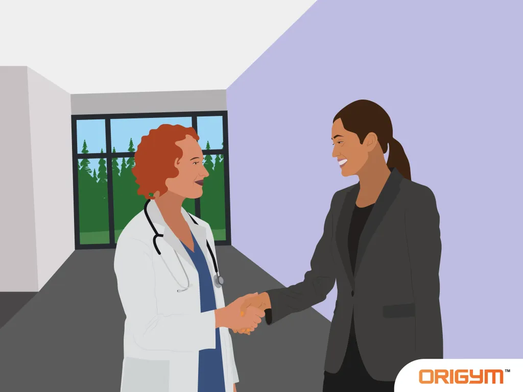 Healthcare Advisor Shaking Hands with Female Patient