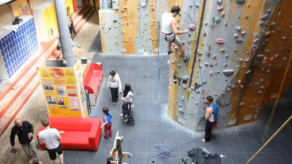 Inside of Castle Climbing London With Groups of People Both Climbing and Watching Others