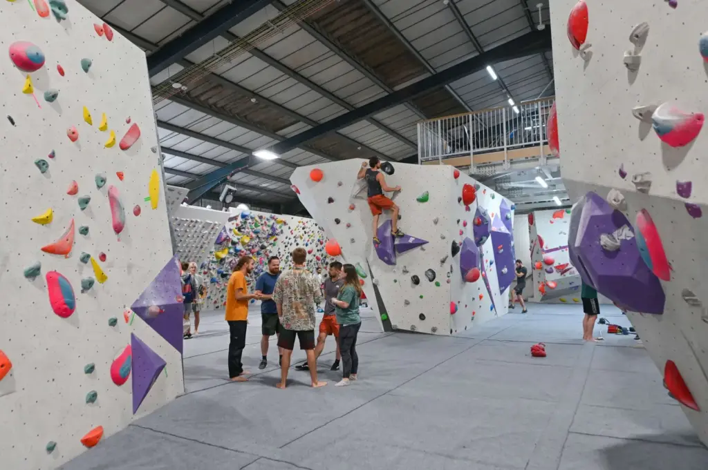 Inside Harrowall Bouldering Gym in London Showing People Climbing & Getting Ready to Climb Walls