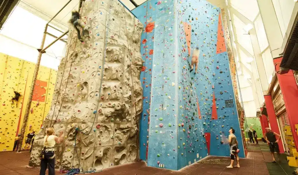 Image Inside Westway Climbing Bouldering Gym, Showing 4 People Climb High Rock Wall Towers